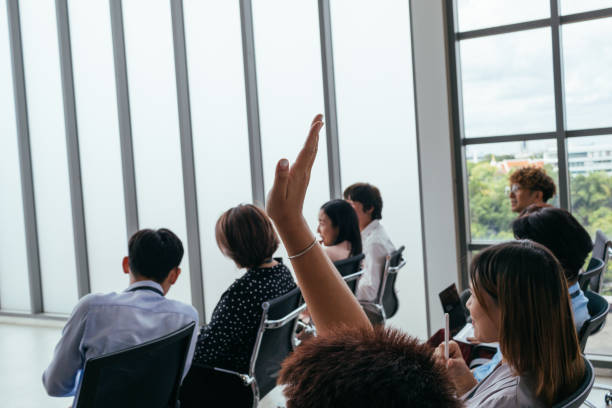 istock Unrecognizable Person Raises Hand During Conference 1513530733