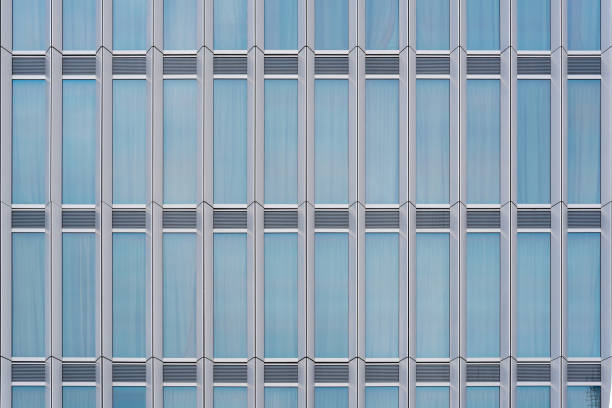 istock glass curtain wall facade of a modern building, with the sky reflected on its surface. 1513535465