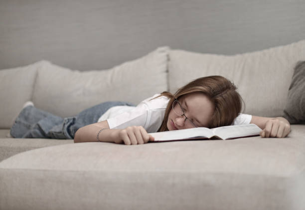 istock The child fell asleep on the book. 1513538304