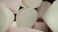 istock A mountain of white and pink marshmallows. Dolly slider extreme close-up. 1513544307