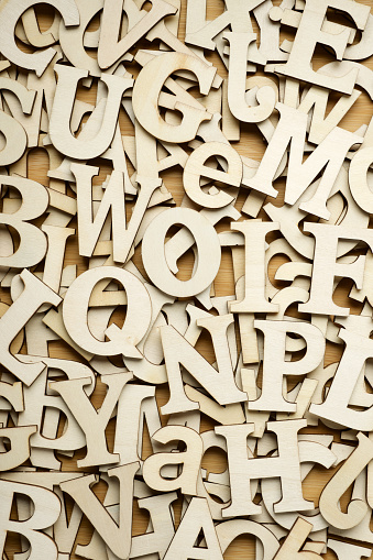Top view of letters to play with on a wooden table