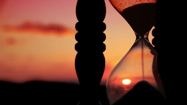 Hourglass with Cloud Background