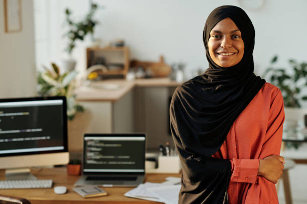 istock Young smiling Muslim home office worker looking at camera 1513613522