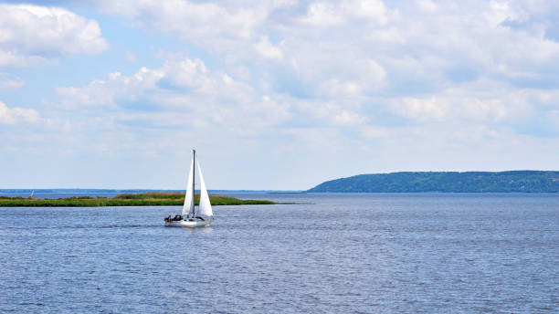 istock Sailing boat yacht on the river blue expanse on a sunny day 1513651855
