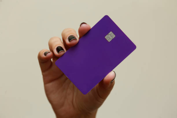 purple credit debit card. Digital payment system. stock photo