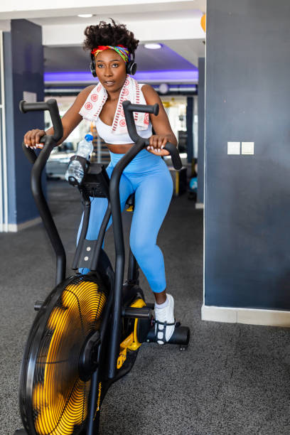 istock A young African female athlete is doing a workout in a gym using an exercise bike. 1513667388