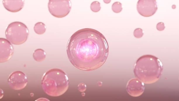 istock 3D cosmetic rendering Pink Bubbles of serum on a fuzzy background. 1513667421