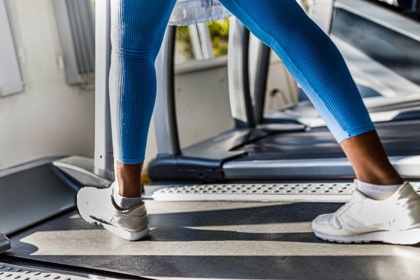 istock Close-Up view of woman's legs on a treadmill. 1513668506