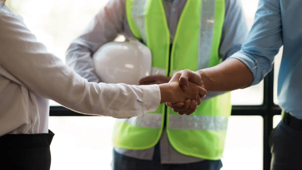 istock Architect and engineer work together and shaking hands to welcome home design projects to work in the same way and work together as a team. 1513702466
