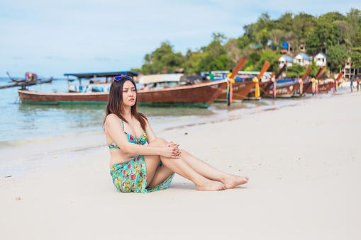 A young women posing in Beautiful Island of Koh Lipe with Sandy Beaches