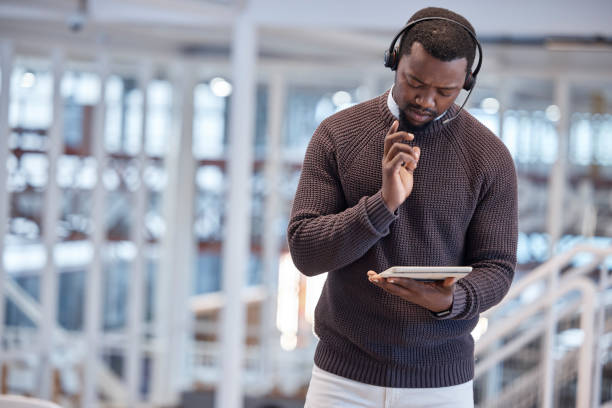 istock Call center, tablet and confused black man in office for working, customer support or service. Telemarketing, thinking and technology of serious African person looking for solution or problem solving 1513739868