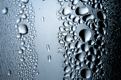 Close up of water condensation drops on clear glass