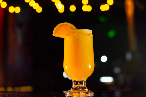 Citrus Refreshment: Orange Juice at Night Bar