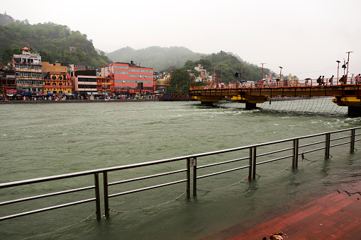 Holy River Ganges flowing in Haridwar during rainy season perspective view