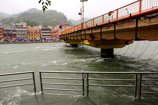 Holy River Ganges flowing in Haridwar during rainy season perspective view