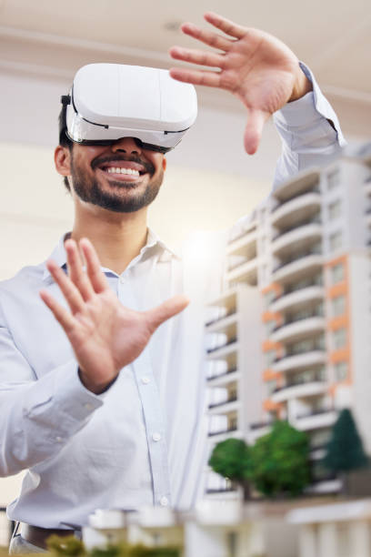 istock Architect, happy man and virtual reality architecture model, construction and building, future technology and UX. VR goggles, design and engineering, metaverse and simulation of property development 1513773420