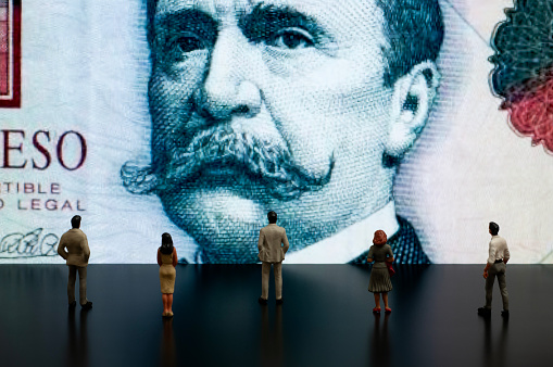 Businessman/Politician figurines scrutinize the Argentina Peso on screen (Economy of Argentina)