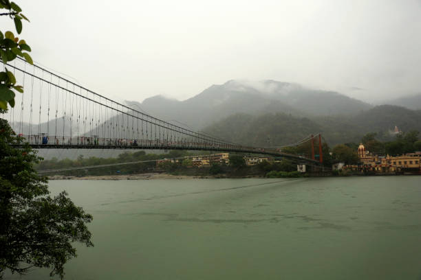 istock People crossing Ram Jhula/ Bridge during rainy season in Rishikesh/ Haridwar, India. 1513781677