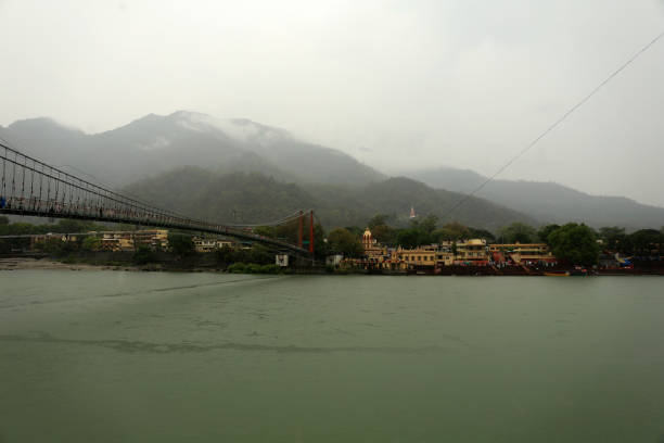 istock People crossing Ram Jhula/ Bridge during rainy season in Rishikesh/ Haridwar, India. 1513781680