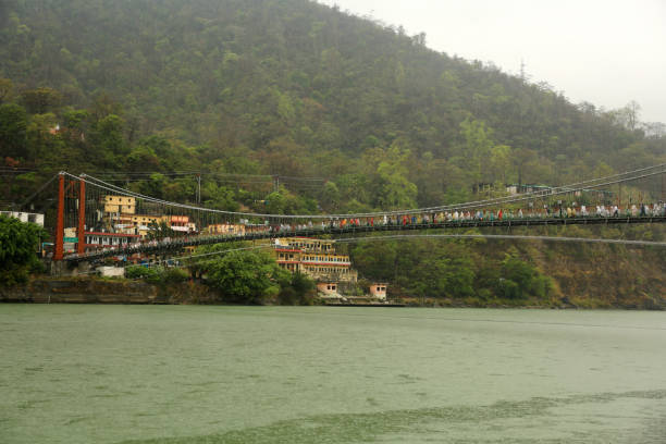 istock People crossing Ram Jhula/ Bridge during rainy season in Rishikesh/ Haridwar, India. 1513781686