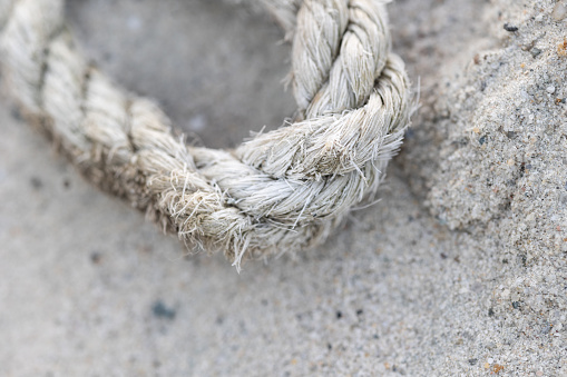 3d rendering of a rope tied in a lasso and flying on a white background. Catching your prize. Cowboy tools. Roping in your luck.