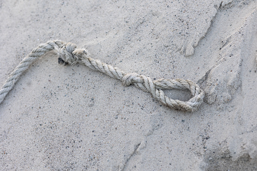 Rope on Sand. No people.