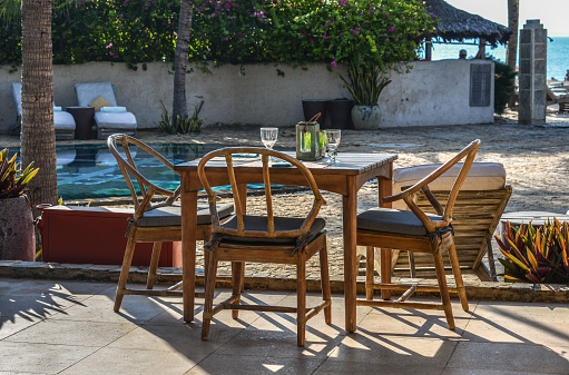 Outdoor furniture in the luxury restaurant, tables and chairs.