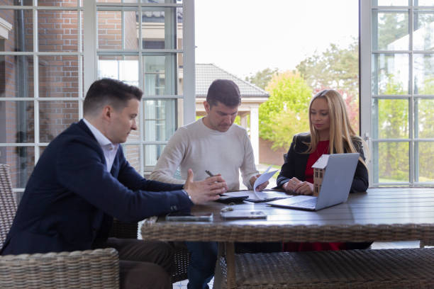 istock Potential client signing sale agreement with agents help 1513816961