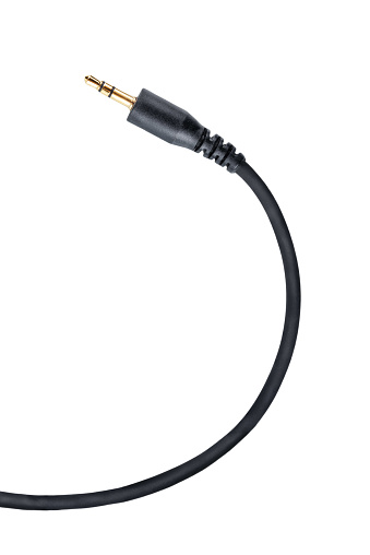Black audio jack plug with cable on a white isolated background.