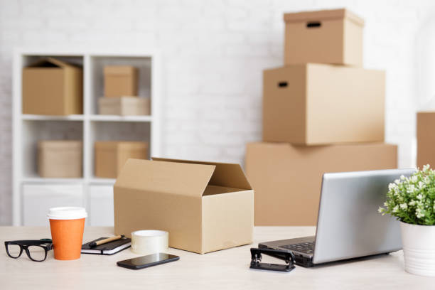 istock table with laptop computer and shipping boxes in post office 1513831342