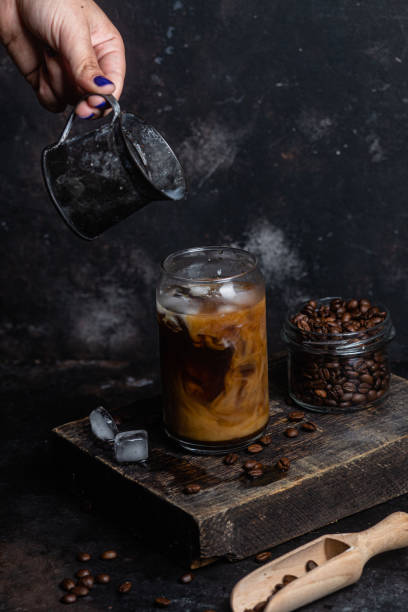 istock Cold coffee in a glass on a dark background 1513842378