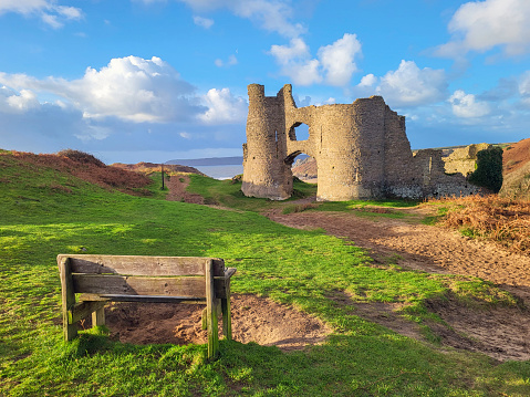 Pennard Castle was built in the early 12th century as a timber ringwork following the Norman invasion of Wales. It is located on the cliff overlooking Three Cliffs Bay.