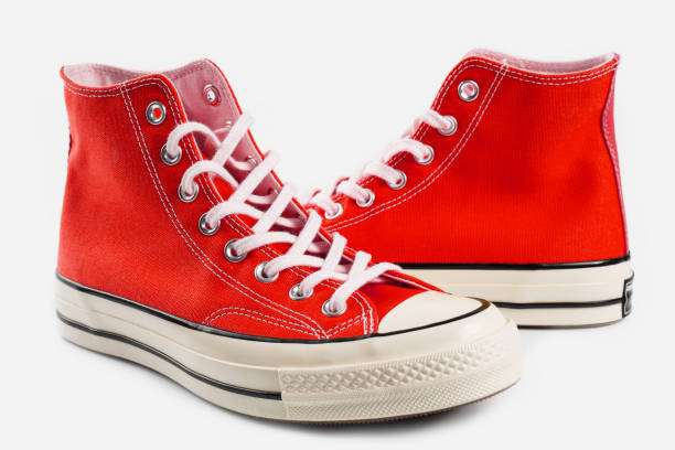 istock Red sneakers on white background with copy space. Youth shoes. 1513878978