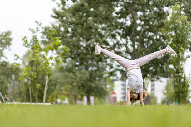 Child doing gymnastics at the park
