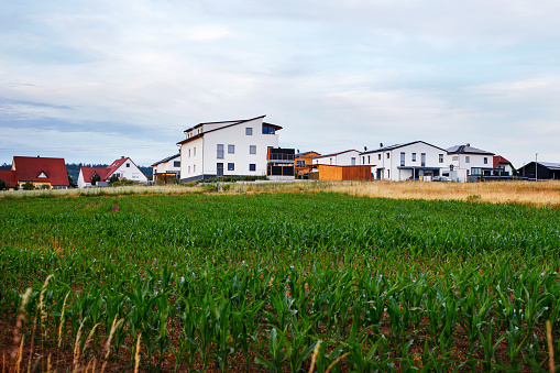 european german modern village near corn field. landscape