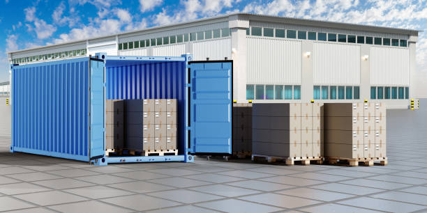 istock Container in territory of plant. Cardboard boxes on pallet. Container for transporting goods. Territory of factory in sunny weather. Concept of supplying raw materials to plant. 3d image 1513908029