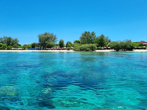 lombok, Indonesia - March 22, 2023 : beaches in the Senggigi beach area, Gili Trawangan Island and Gili Meno Island on Lombok Island. To go to the islands, you can use a fishing boat or speed boat