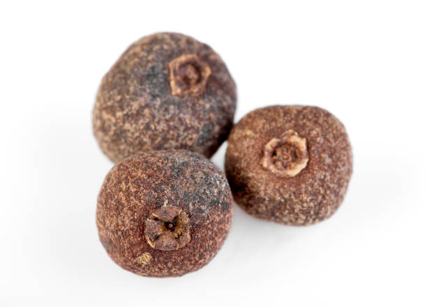 istock whole allspice isolated on white background. Aromatic allspice. 1514043558