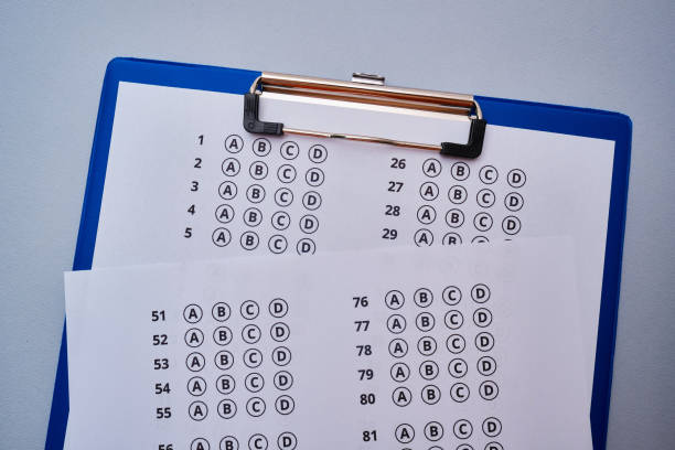 istock Admission test. Examination form. Choosing the correct answer. A sheet of paper with a test task. School exam. University quiz. Right or wrong option. Student to study. Elementary school question. Scoring and result 1514089854