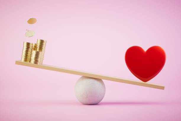 istock Heart and money on balance scale. 3d render 1514133712