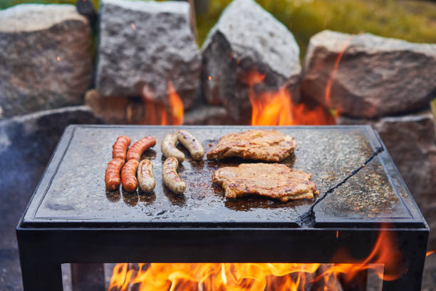 istock Steaks and sausages barbeque. 1514183452