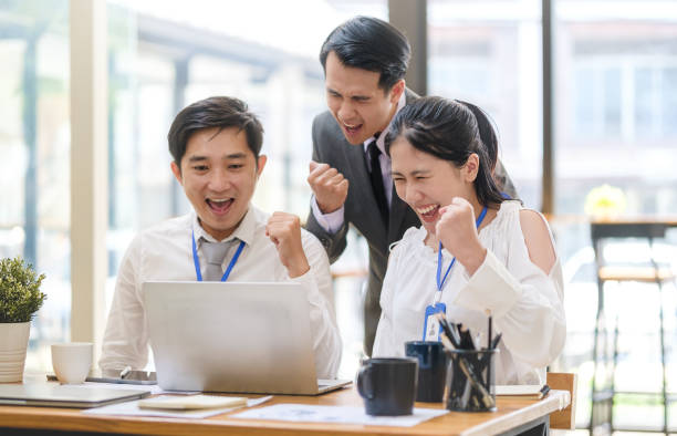 istock business team celebrating successful project or achievement in office. Teamwork, collaboration concept. 1514183993
