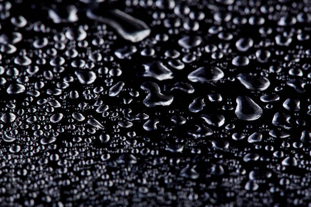 istock Colored water droplets on a gold background. Abstract liquid sprays 1514196919