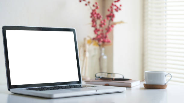 istock Workspace desk and laptop. copy space and blank screen. 1514213487