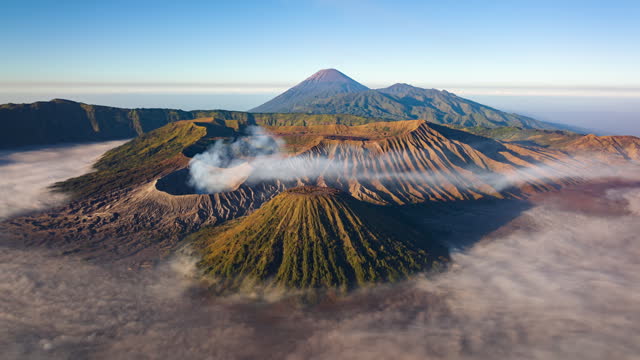 4K Hyperlapse aerial view flying to mount Bromo active volcano above sea of clouds, Java, Indonesia