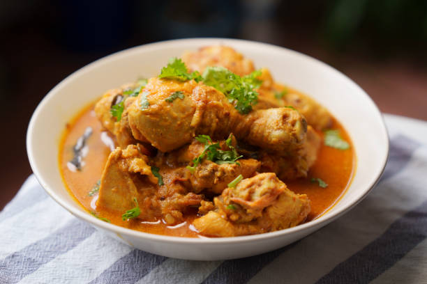Indian curry chicken served in white bowl