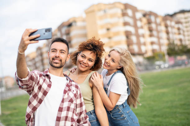 istock Friends take a selfie in the park on a spring day 1514255235