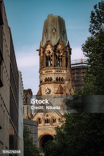 istock Berlin's iconic Kaiser-Wilhelm-Gedächtnis-Kirche, a symbol of regeneration amid bustling city life. 1514276548
