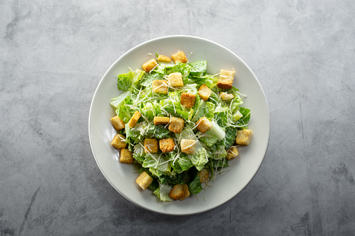 A top down view of a Caesar salad.