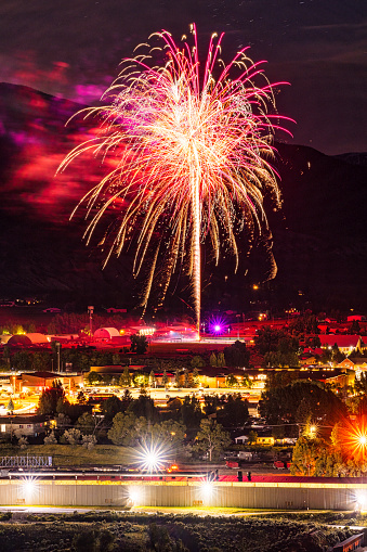 Fourth of July Fireworks at Night - Gypsum, Colorado fireworks display time lapse at night with view of town and lights.